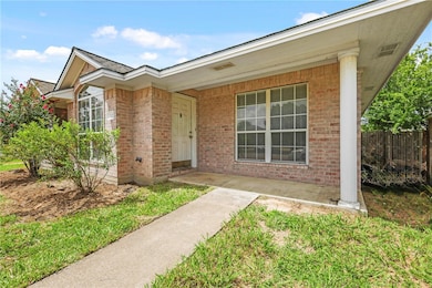 Doorway to property with brick siding