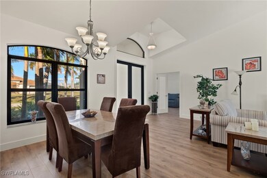 Dining room with hardwood / wood-style floors, vau