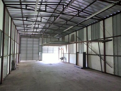 Garage featuring metal wall