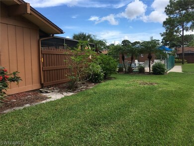Side/back of the home with the pool in the background