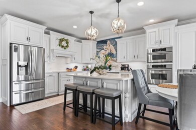 Kitchen featuring dark hardwood / wood-style floor