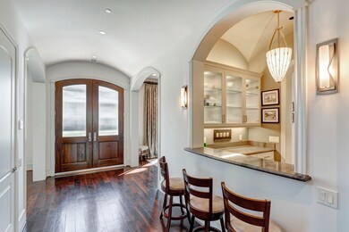 Entry and wet bar pass through. Guest can grab a r