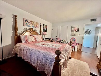 Bedroom with wood finished floors