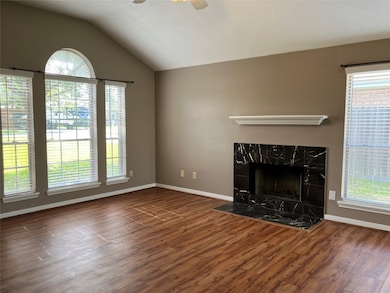 Another view of the living room with wood burning