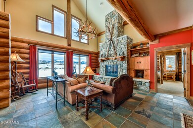 Living room with floor to ceiling stone