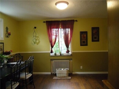 Two windows in Dining room bring in natural light.