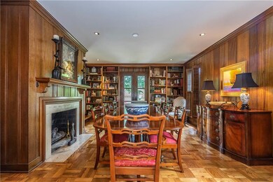 Large formal living room with fireplace - could al
