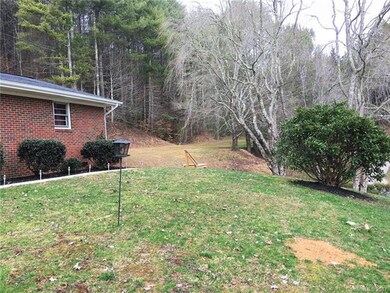 Looking at the extra cleared lot beside the home i