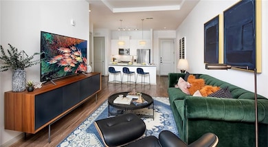 Living room with dark hardwood / wood-style floori