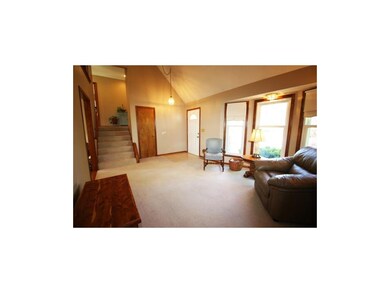 Open Entry to Front Living Room with Bay Window. C