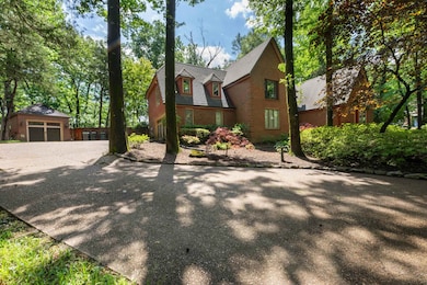 View of front of home featuring an outbuilding, dr