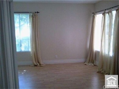 French doors lead to sunny master bedroom