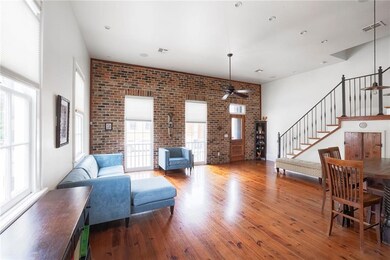 walk into this open living room with ample light
