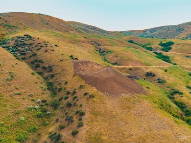 Aerial view of property and surrounding area with rural landscape