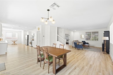 Dining area featuring light wood finished floors,