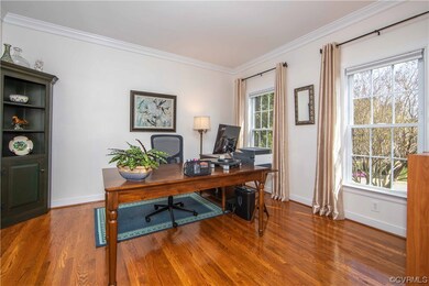 Office or study with hardwood floors.
