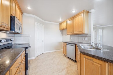 Kitchen with stainless steel appliances, a sink, 