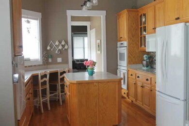 Kitchen with island, pantry and loads of windows