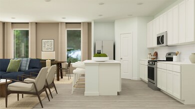 Kitchen with appliances with stainless steel finishes, a center island, light wood-type flooring, and a breakfast bar