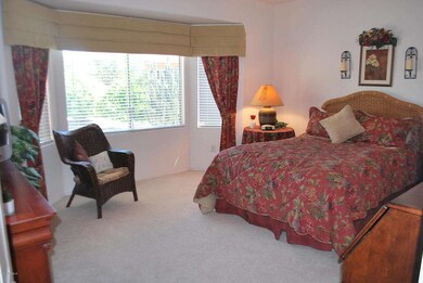 Master bedroom w/ bay window