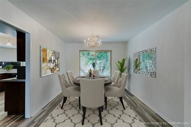 Dining room with a view of the rich, green, backya
