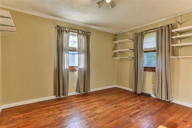 First floor bedroom with hardwoods.