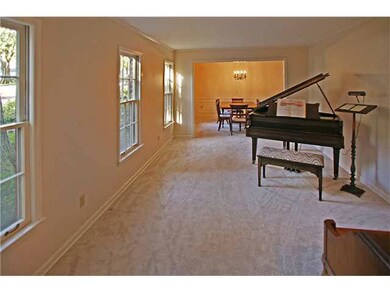 Spacious formal living room which open up to the d