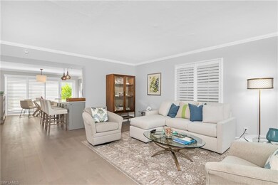 Spacious living and dining room with wood flooring