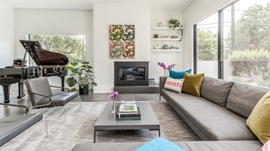 Living room with fireplace and space for the piano