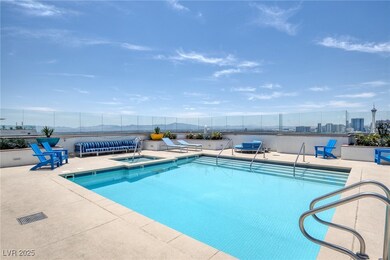 Community pool with a patio area and a community h