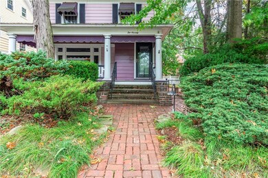 Entrance to property featuring covered porch