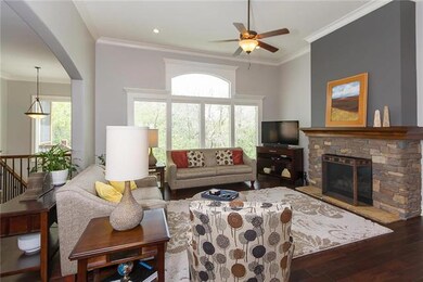 Lovely stone fireplace in great room with accent p