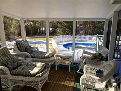 Lovely screened-in porch provides an insect free e