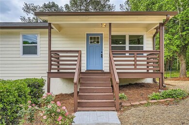 Property entrance with covered porch