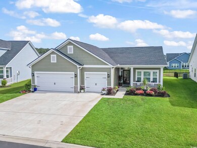 View of front of house with a porch, concrete driv