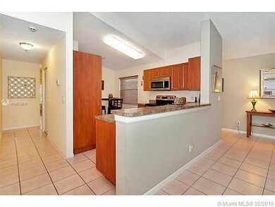 Kitchen with hallway to third bedroom that is in t