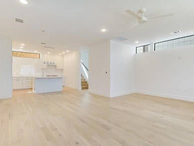 Unfurnished living room with light wood-type floo