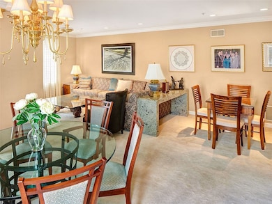 The dining, living and card area is a large L-shape.