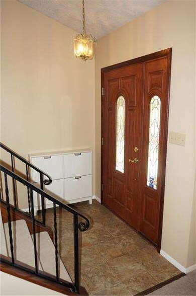 Fresh and inviting entry way with convenient stora