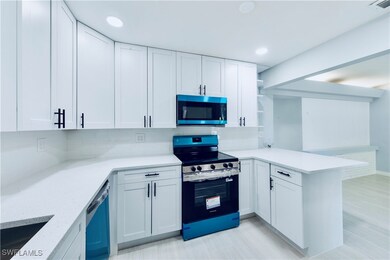 Kitchen with appliances with stainless steel finis