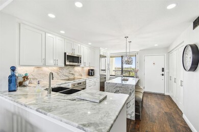 The kitchen has beautiful views of the water in the front and the back!