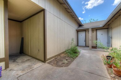 Property entrance featuring roof with shingles