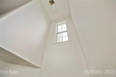 Two-story foyer brings in a lot of natural light.