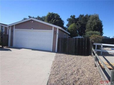 Extra parking and access to back yard.