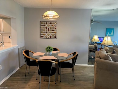 Dining space with ceiling fan, a textured ceiling,