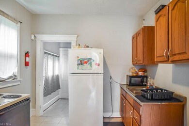 Kitchen with a range and refrigerator.