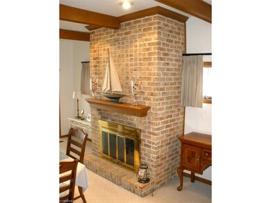 Beautiful brick wood burning fireplace with gas st