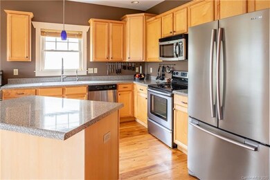 lightly used kitchen is very functional and inviting