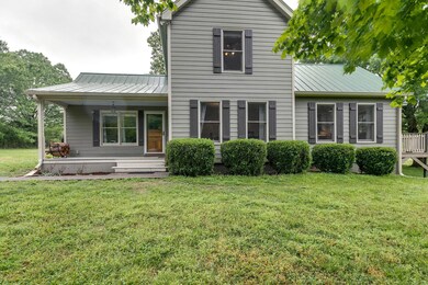 Front porch is perfect for rocking chairs or a swing