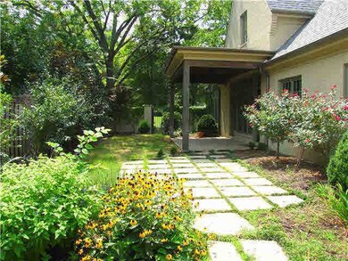 Relax under the covered patio with ceiling fan and